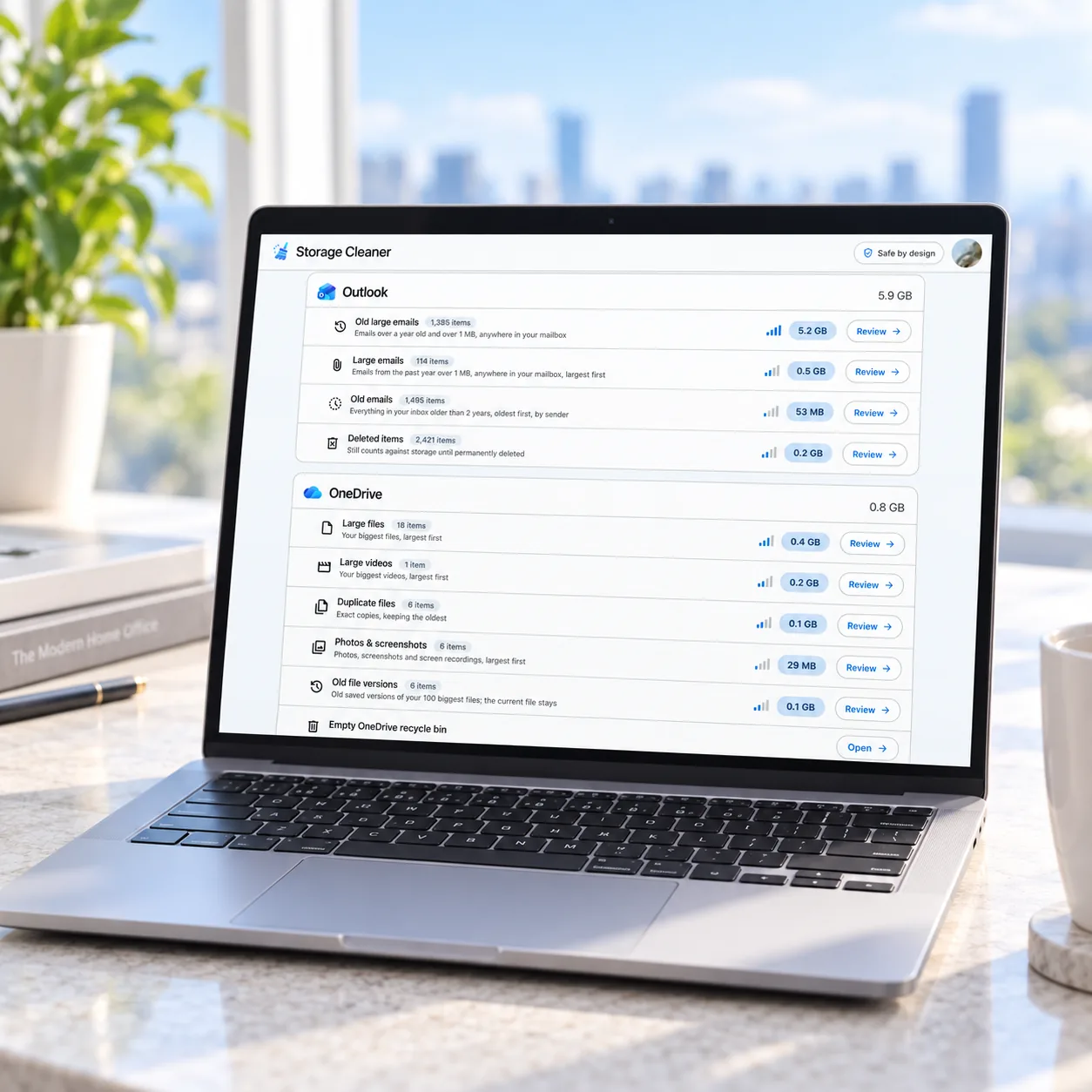 Storage Cleaner showing Outlook and OneDrive cleanup categories on a laptop
